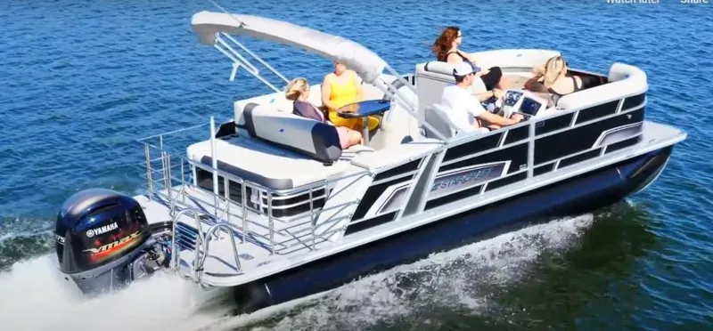 Slide: The Image of 2025 Starcraft EXS 3 Q pontoon boat cruising on a lake with passengers. - 6