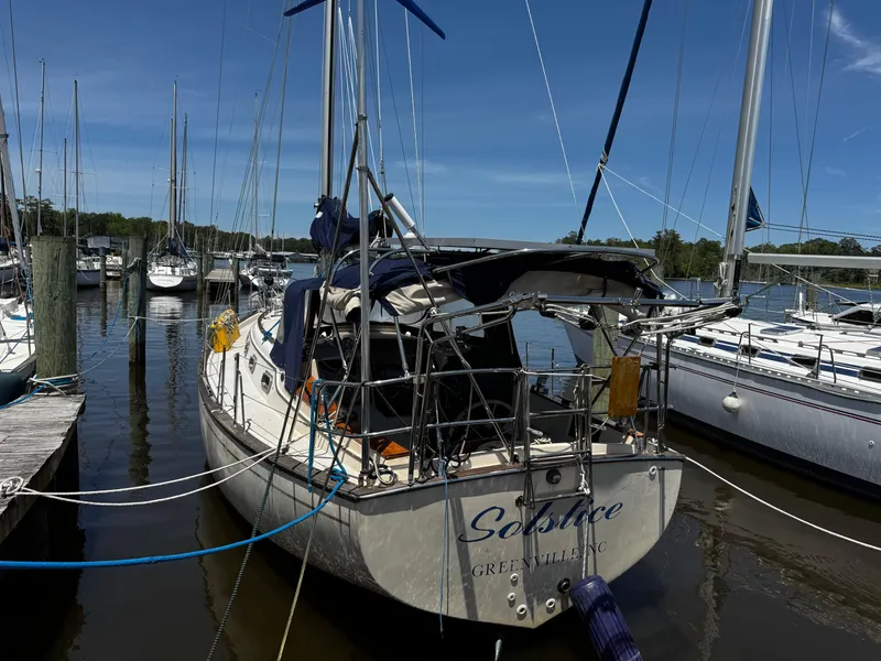 Slide: The Image of Interior view of 1989 Island Packet 35 sailboat cockpit with wooden storage. - 14