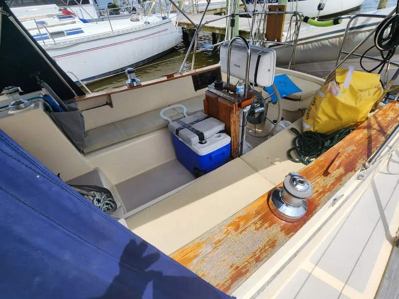 Slide: The Image of 1989 Island Packet 35 sailboat cockpit with winches and ropes. - 15