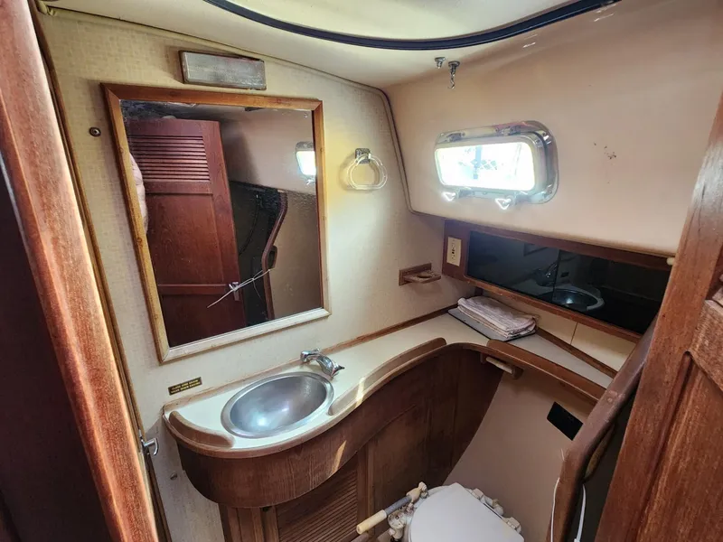 Slide: The Image of Interior of a 1989 Island Packet 35 sailboat with navigation area. - 29