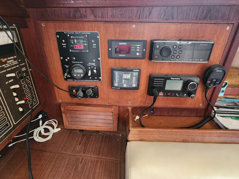 Slide: The Image of 1989 Island Packet 35 sailboat cockpit detail with blue rope and speaker. - 34