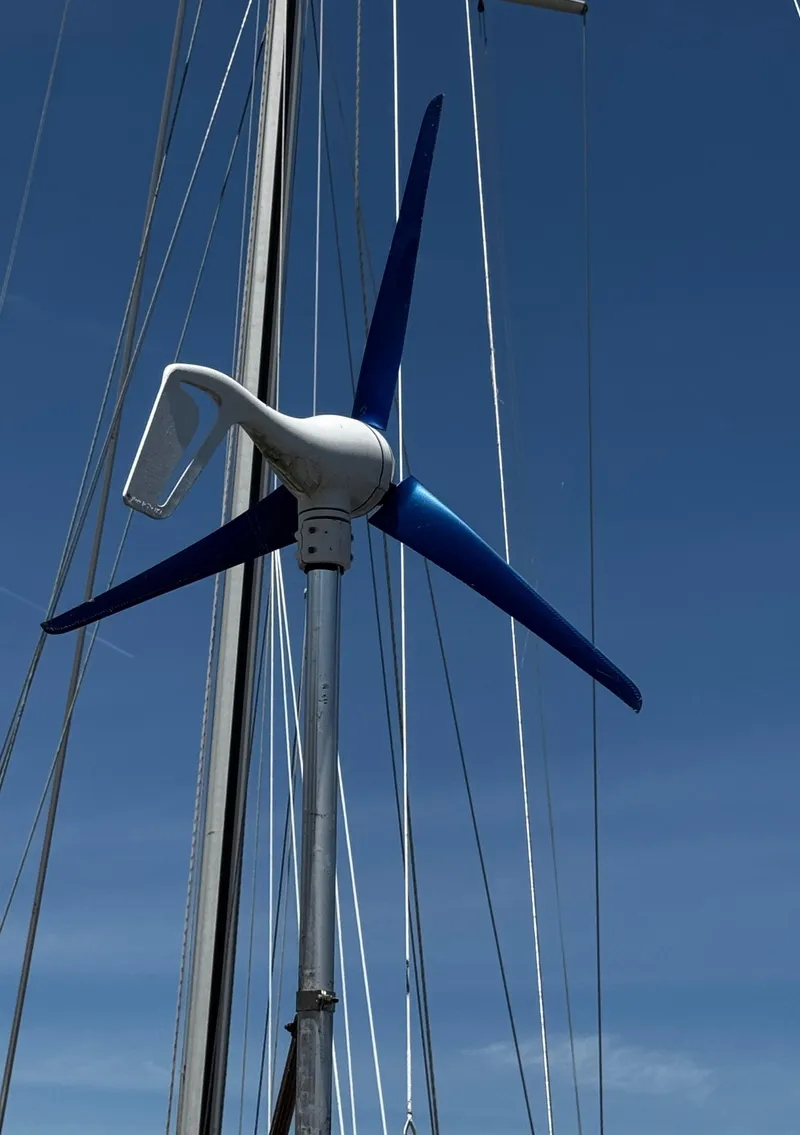 Slide: The Image of Cockpit of 1989 Island Packet 35 sailboat with steering wheel and navigation equipment. - 35