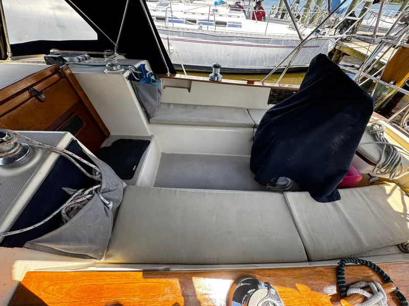 Slide: The Image of Chrome winch on 1989 Island Packet 35 sailboat, docked by water. - 41