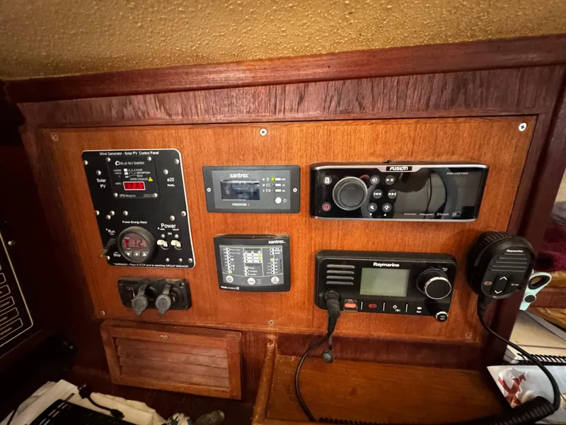 Slide: The Image of Interior of 1989 Island Packet 35 sailboat with navigation station and cabin details. - 57