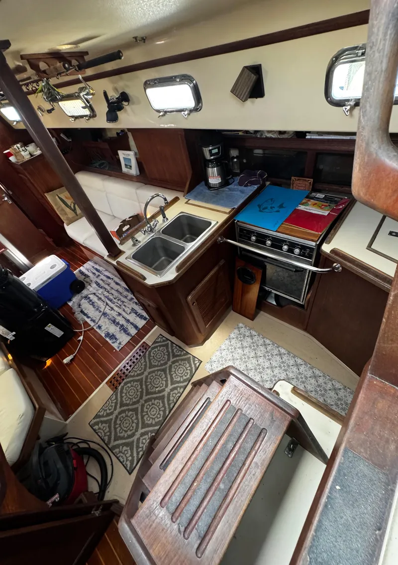 Slide: The Image of Control panel of a 1989 Island Packet 35 sailboat with various electronic devices. - 64