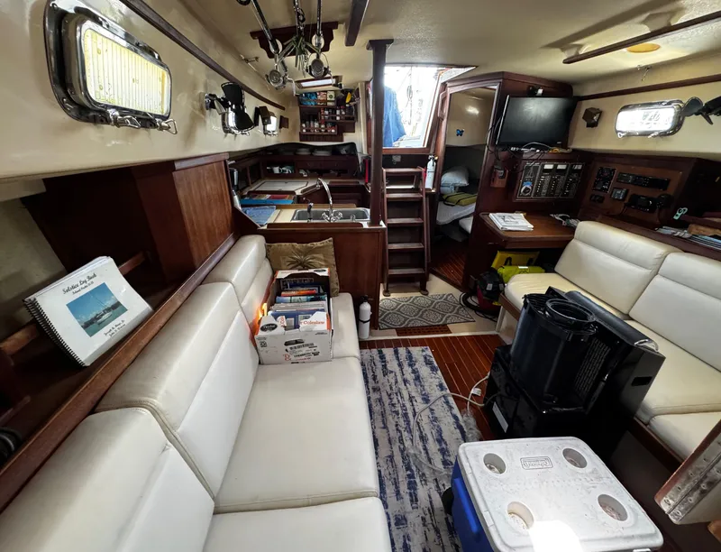 Slide: The Image of Interior of 1989 Island Packet 35 sailboat with wooden cabinetry and storage. - 69