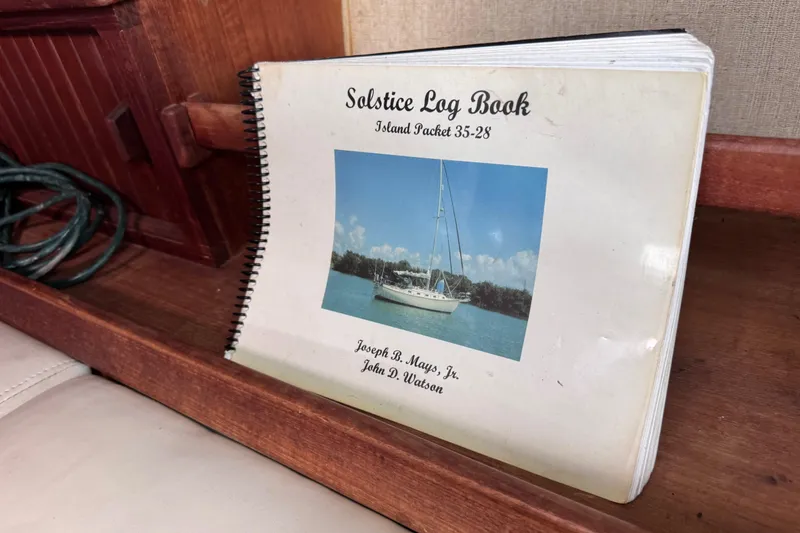 Slide: The Image of Log book titled "Solstice" for Island Packet 35 sailboat, 1989 model. - 97