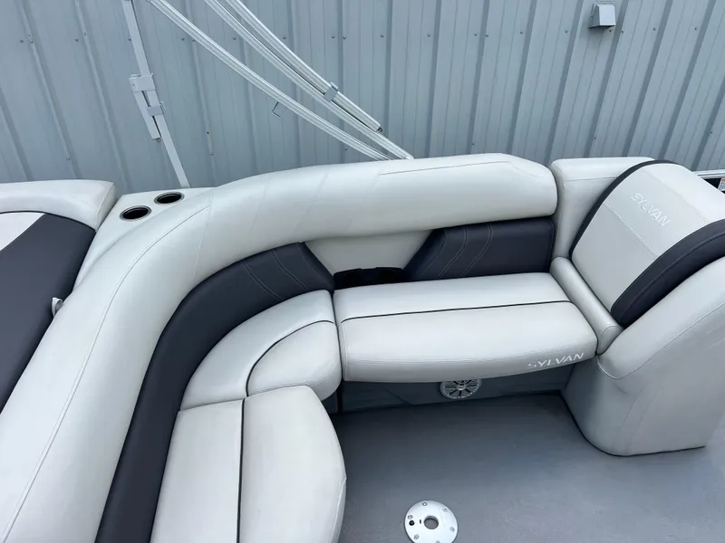 Slide: The Image of 2022 Sylvan Mirage 820 CRS C boat interior with white and gray seating. - 7
