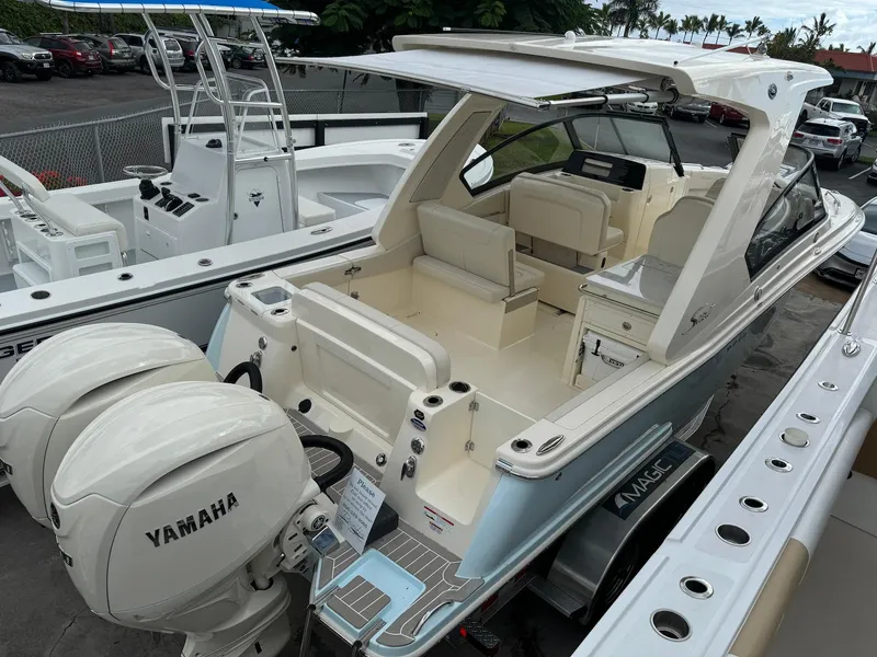Slide: The Image of 2025 Scout 277 Dorado boat with Yamaha engines, docked and ready for adventure. - 11