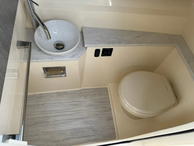 Slide: The Image of Modern bathroom in 2025 Scout 277 Dorado boat with sink and toilet. - 18