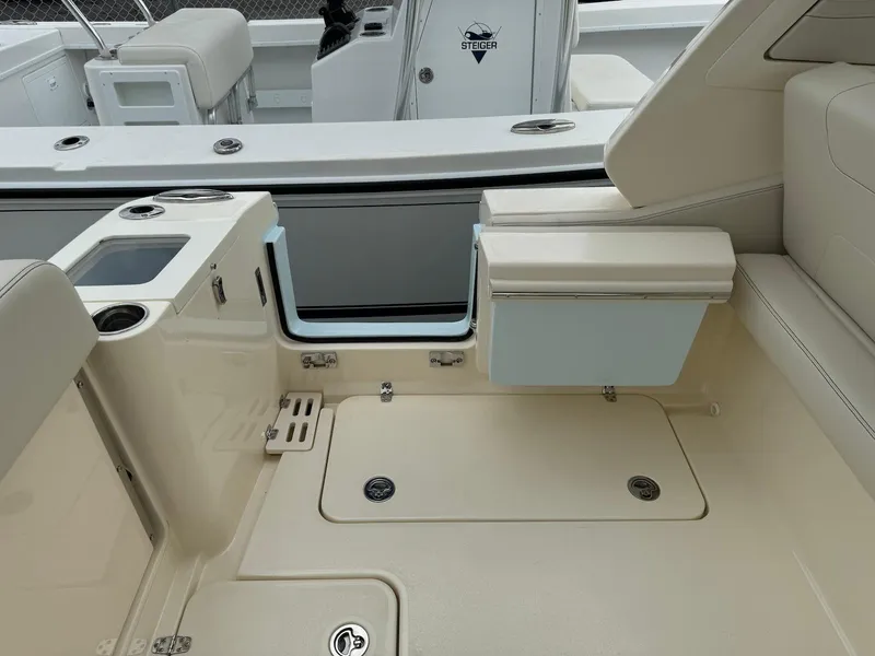 Slide: The Image of 2025 Scout 277 Dorado boat interior with seating and storage compartments. - 19