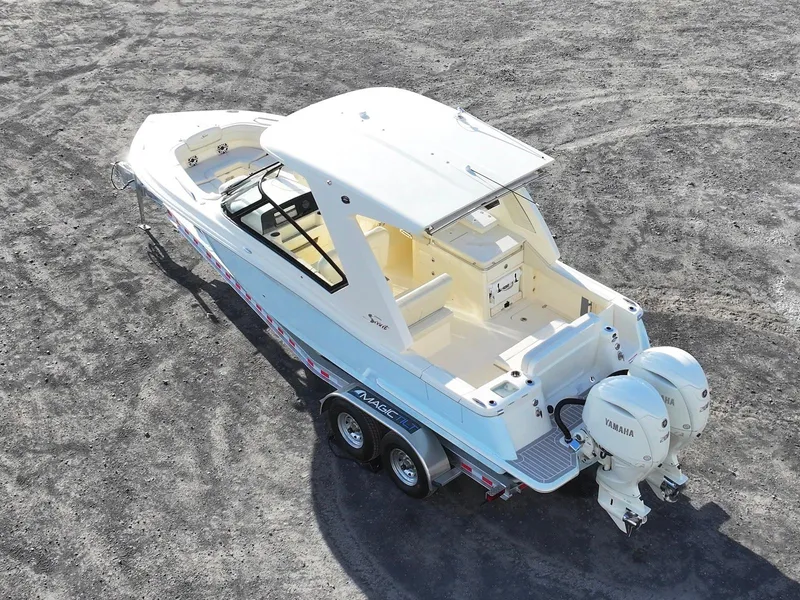 Slide: The Image of 2025 Scout 277 Dorado boat on trailer, aerial view, dual Yamaha engines. - 4