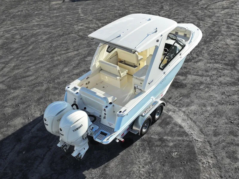 Slide: The Image of 2025 Scout 277 Dorado boat with dual Yamaha engines on a trailer. - 6
