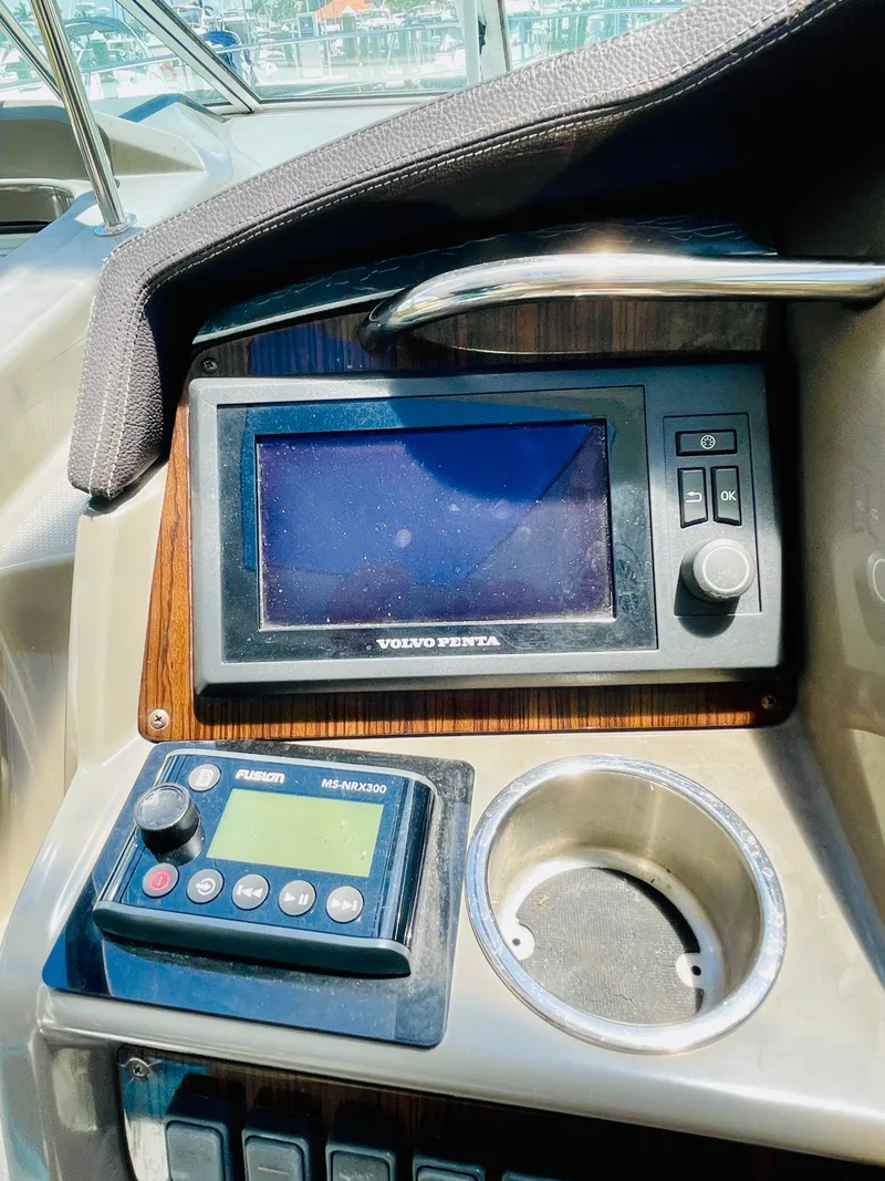 Slide: The Image of Control panel of a 2012 Cruisers 350 Express boat with Volvo Penta display. - 13