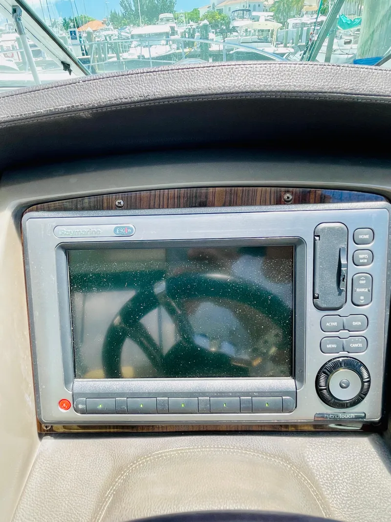 Slide: The Image of 2012 Cruisers 350 Express boat dashboard with navigation system. - 14