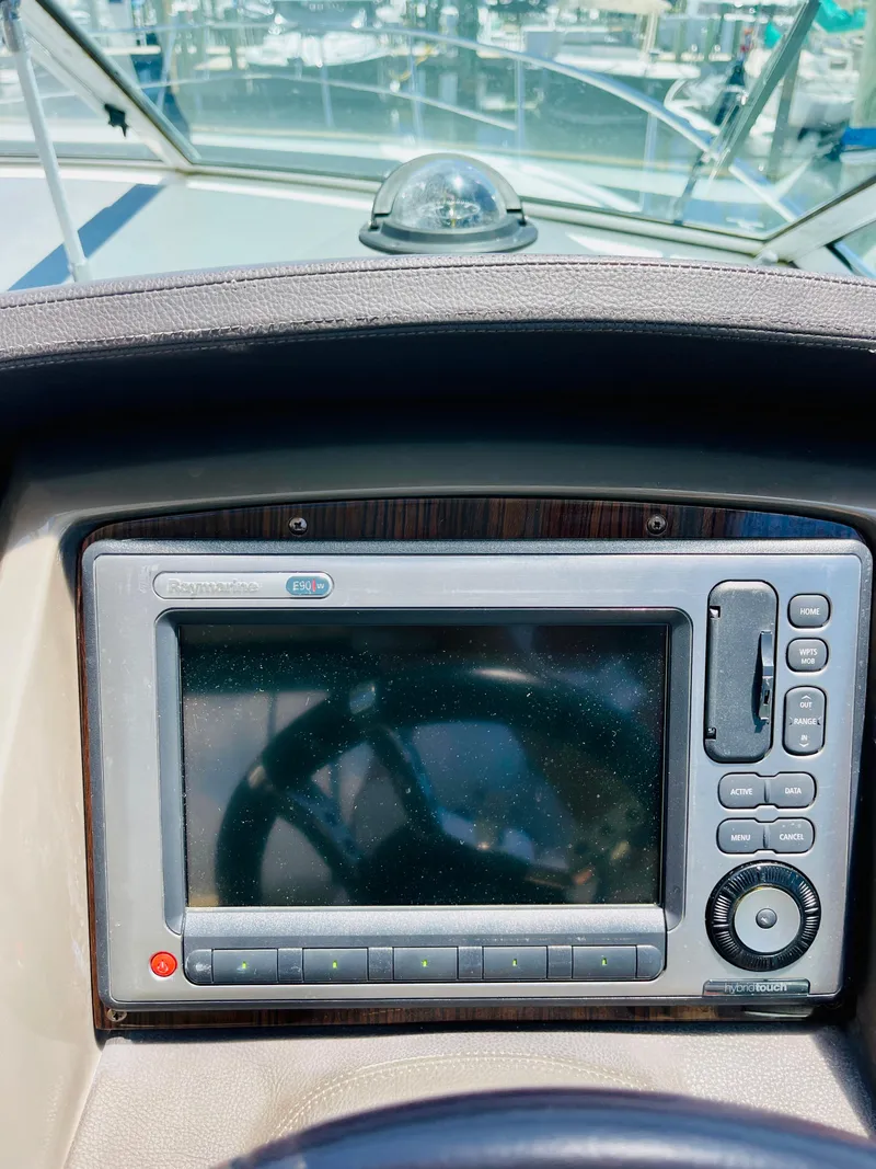 Slide: The Image of 2012 Cruisers 350 Express boat dashboard with navigation system. - 16