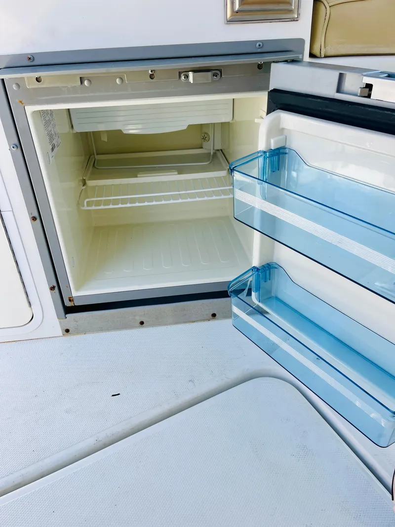 Slide: The Image of Open refrigerator on a 2012 Cruisers 350 Express boat. - 20