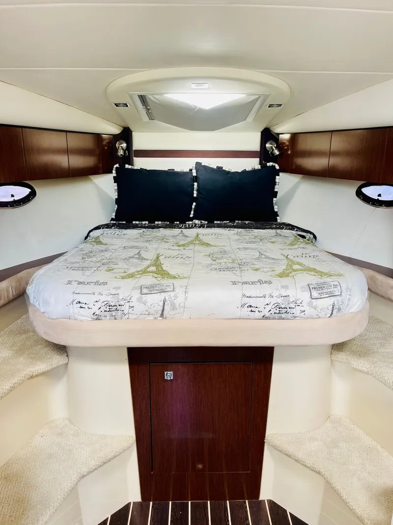 Slide: The Image of Luxurious cabin interior of 2012 Cruisers 350 Express yacht with cozy bed and elegant decor. - 23