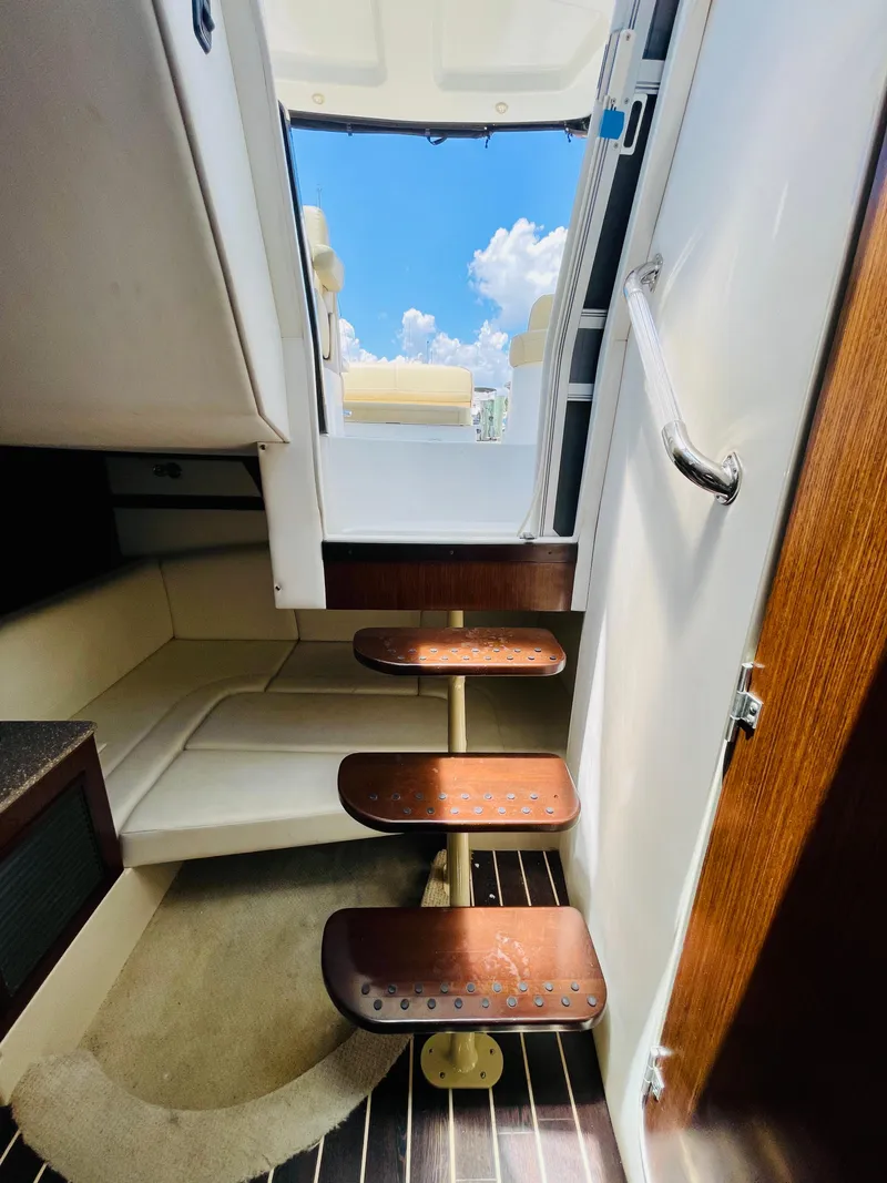 Slide: The Image of Interior stairs of a 2012 Cruisers 350 Express yacht with a view of the deck. - 27