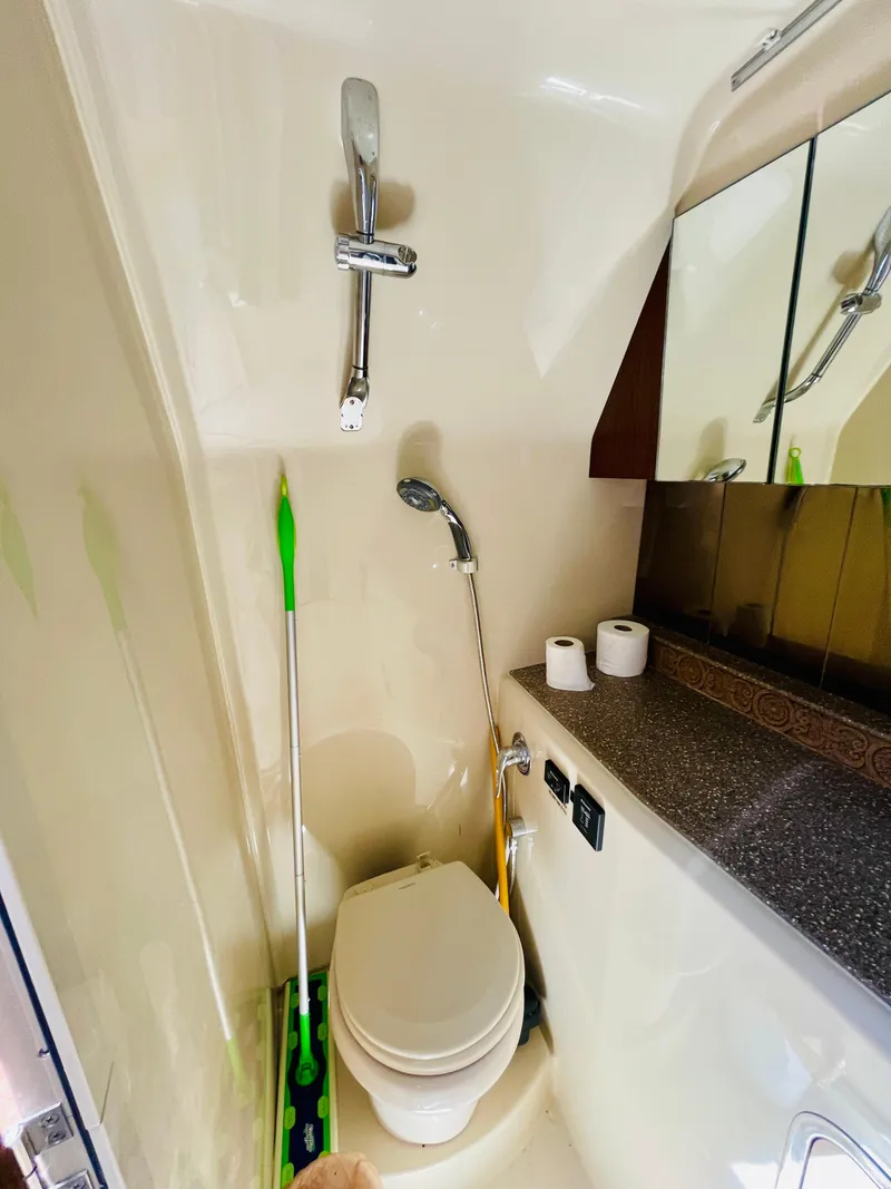 Slide: The Image of 2012 Cruisers 350 Express bathroom with shower, toilet, and vanity. - 30