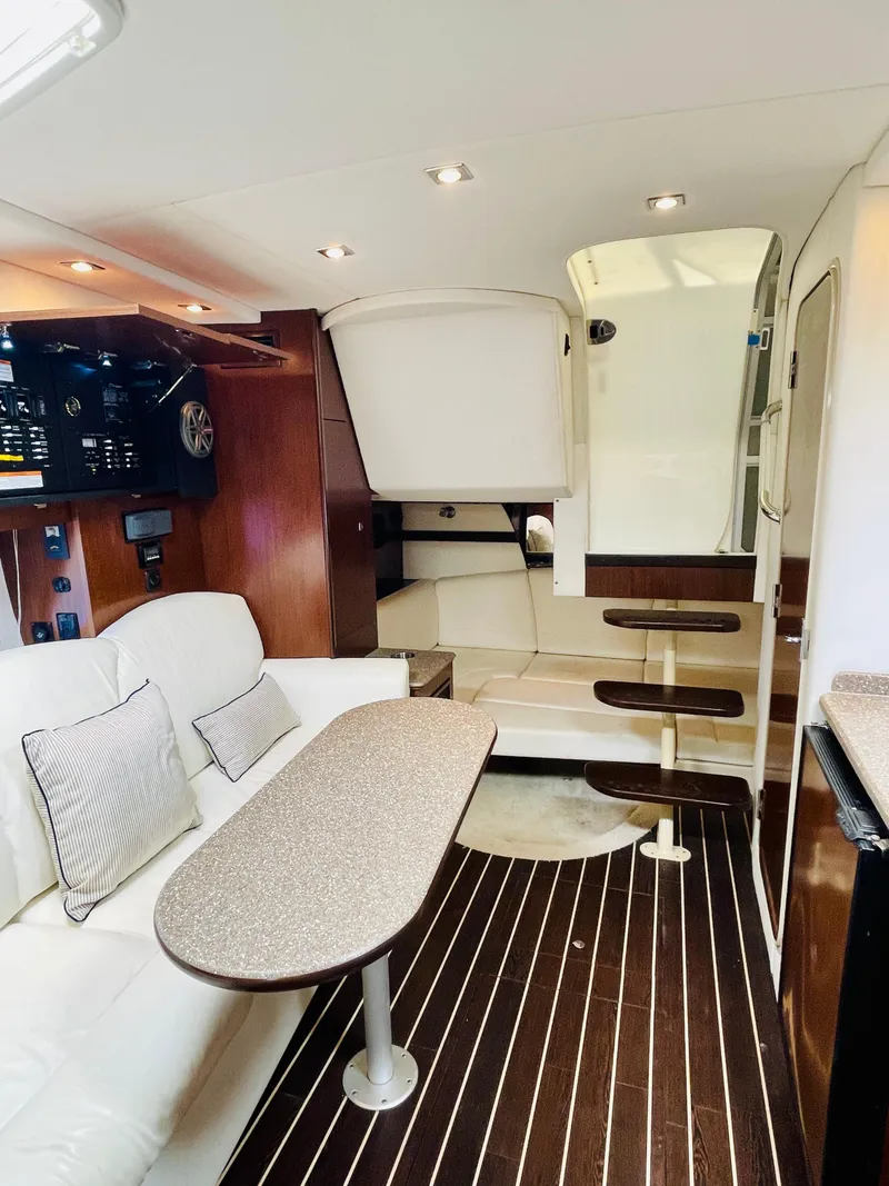 Slide: The Image of Interior of 2012 Cruisers 350 Express yacht with modern seating and wooden flooring. - 37