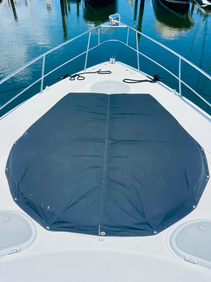 Slide: The Image of 2012 Cruisers 350 Express boat bow with sunpad cover. - 46