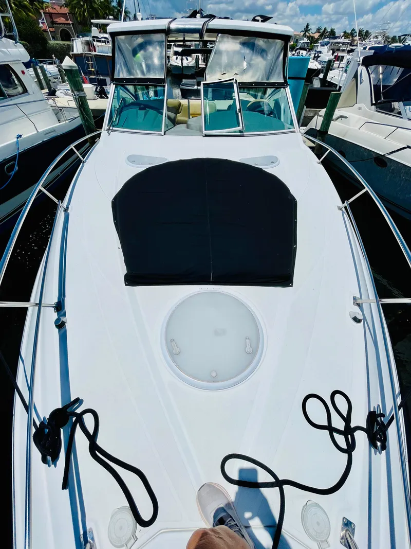 Slide: The Image of 2012 Cruisers 350 Express yacht docked at a marina. - 49