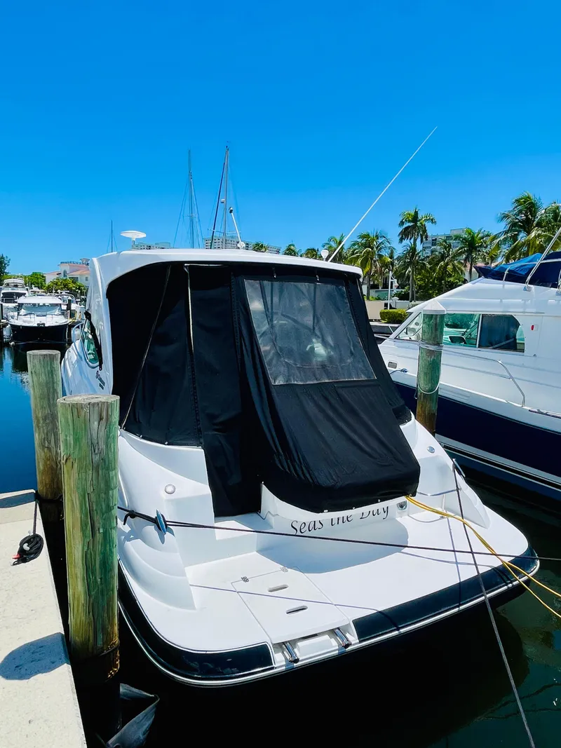 Slide: The Image of 2012 Cruisers 350 Express yacht docked at marina on a sunny day. - 6