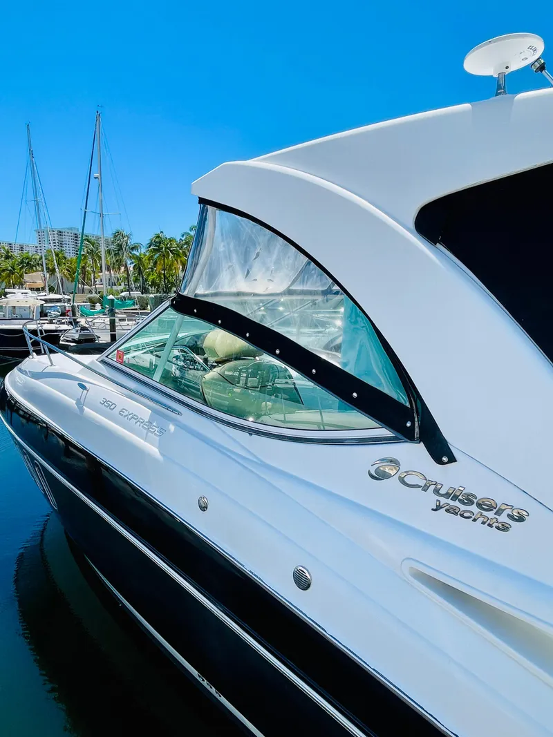 Slide: The Image of 2012 Cruisers 350 Express yacht docked at marina. - 8