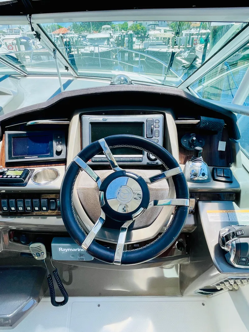 Slide: The Image of 2012 Cruisers 350 Express helm with modern navigation equipment. - 9