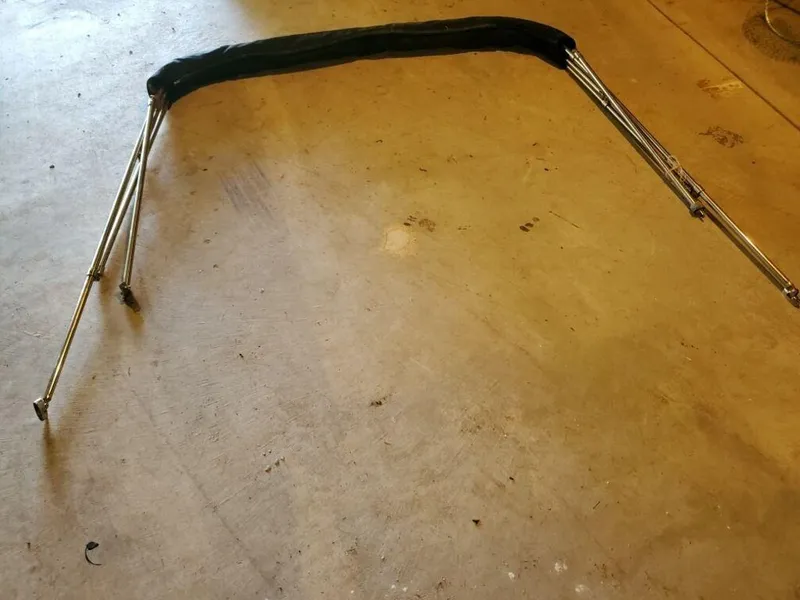 Slide: The Image of Bimini top frame for 2006 Mako 195DC boat on concrete floor. - 3