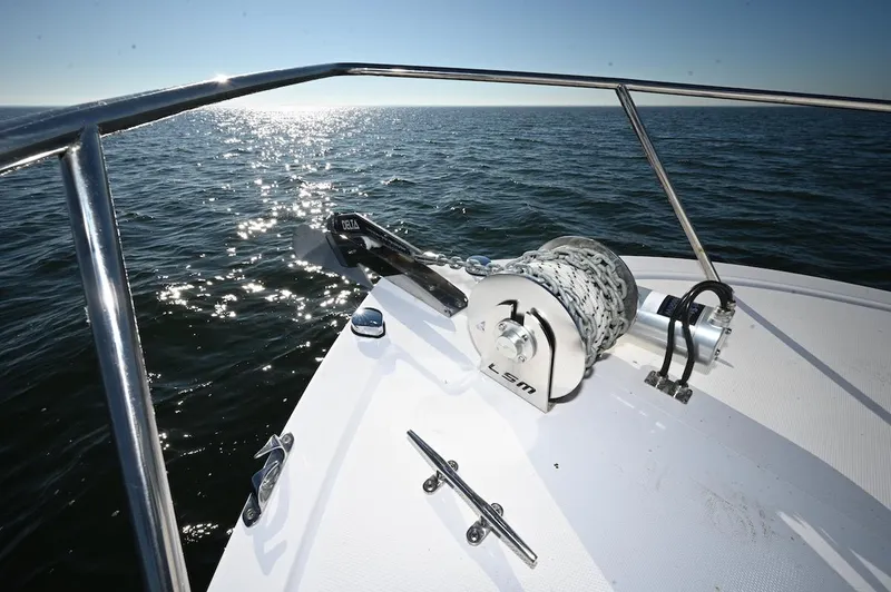 Slide: The Image of Bow of 2025 Steiger Craft 255 Miami boat with anchor, on sunny ocean. - 15