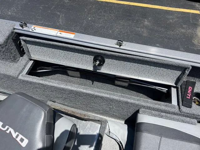 Slide: The Image of 2017 Lund Impact XS 1850 boat interior storage compartment. - 10