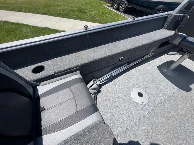 Slide: The Image of 2017 Lund Impact XS 1850 boat interior with seating and storage compartments. - 11