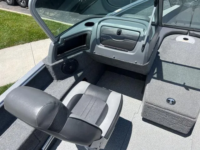 Slide: The Image of 2017 Lund Impact XS 1850 boat interior with seating and storage compartments. - 13