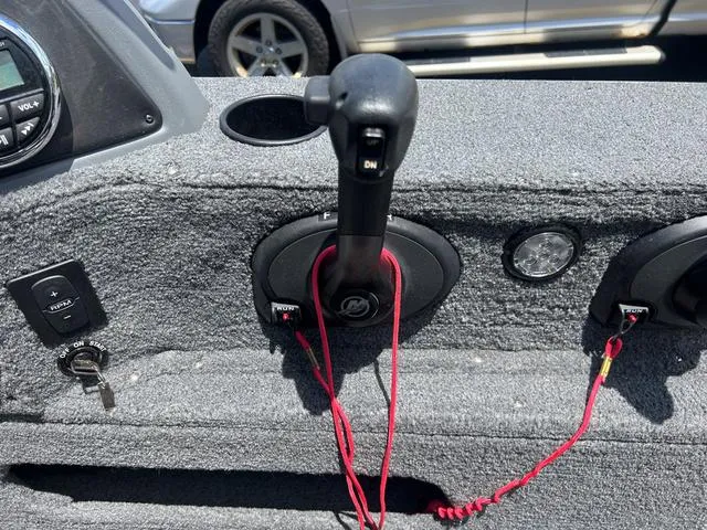 Slide: The Image of 2017 Lund Impact XS 1850 boat control panel with throttle and ignition key. - 17