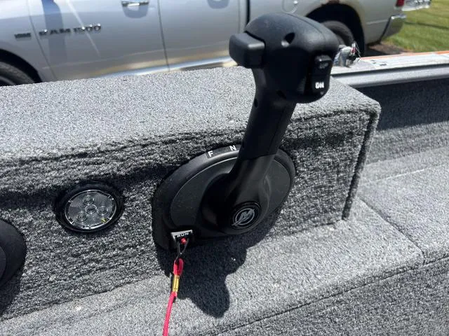 Slide: The Image of 2017 Lund Impact XS 1850 boat throttle control and dashboard detail. - 18