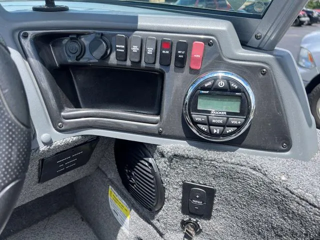 Slide: The Image of 2017 Lund Impact XS 1850 boat dashboard with controls and stereo system. - 19