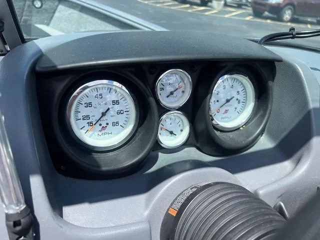 Slide: The Image of Dashboard gauges of a 2017 Lund Impact XS 1850 boat. - 22