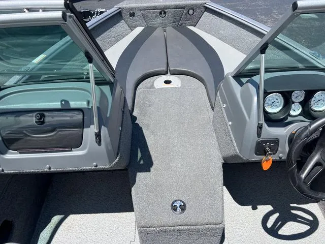 Slide: The Image of 2017 Lund Impact XS 1850 boat interior with open windshield and dashboard. - 24