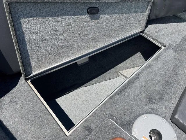 Slide: The Image of Open storage compartment in a 2017 Lund Impact XS 1850 boat. - 26