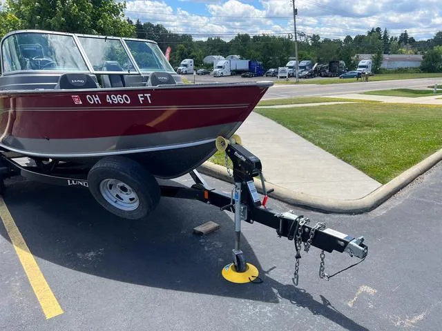 Slide: The Image of 2017 Lund Impact XS 1850 boat on trailer in parking lot. - 3