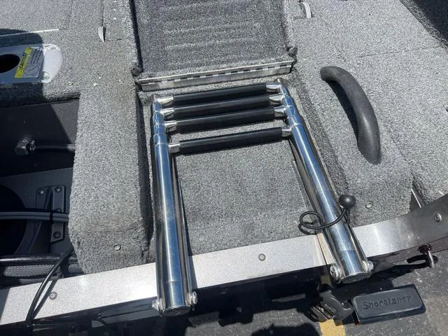 Slide: The Image of 2017 Lund Impact XS 1850 boat with foldable ladder and carpeted deck. - 6