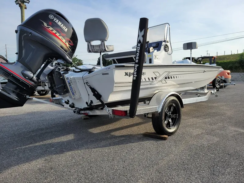 Slide: The Image of 2025 Xpress H190 Bay Boat on trailer with Yamaha outboard motor. - 11