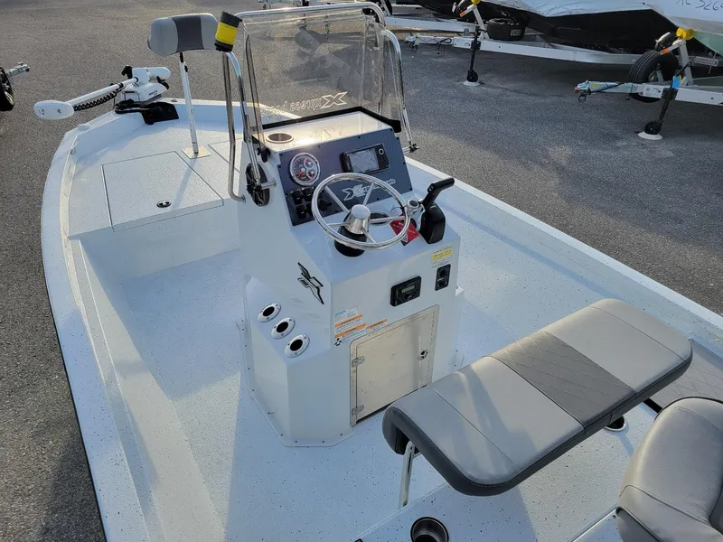 Slide: The Image of 2025 Xpress H190 Bay Boat interior with steering console and seating, in stock. - 13