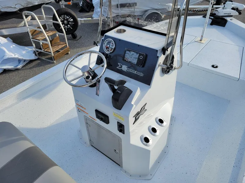 Slide: The Image of 2025 Xpress H190 Bay Boat console with steering wheel and controls. - 17