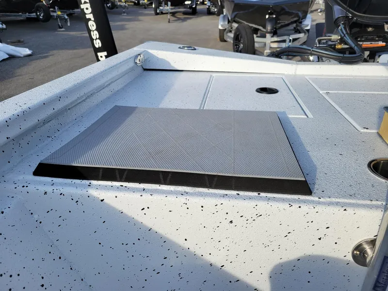 Slide: The Image of 2025 Xpress H190 Bay Boat deck with textured surface and storage compartments. - 18