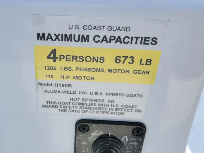 Slide: The Image of 2025 Xpress H190 Bay Boat capacity label, 4 persons, 673 lbs, 115 HP motor. - 5