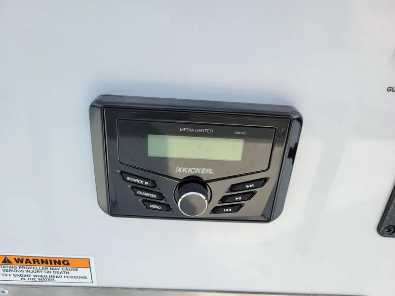 Slide: The Image of Kicker media center on 2025 Xpress H190 Bay Boat dashboard. - 6