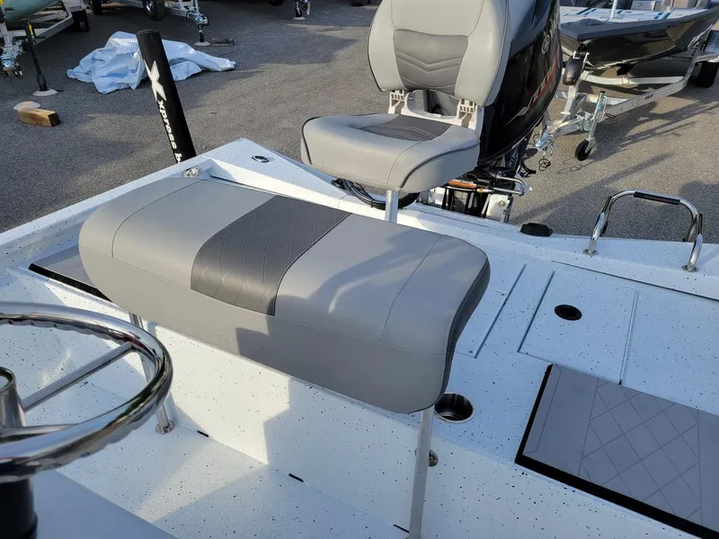 Slide: The Image of 2025 Xpress H190 Bay Boat interior with gray seating and steering wheel. - 8